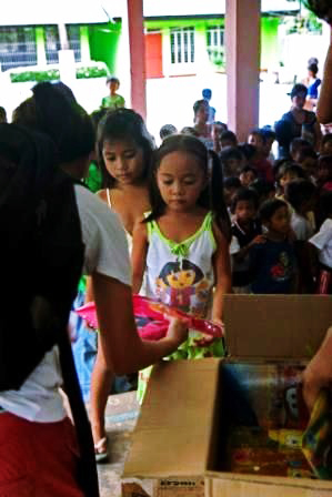 photo: a girl handed in school suplly