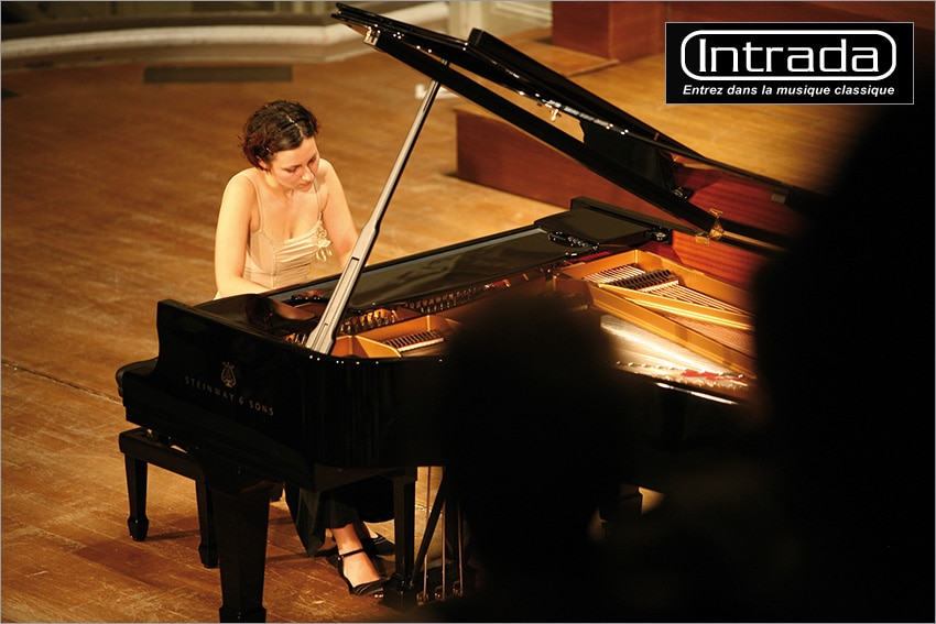 photo: a woman playing the grand piano