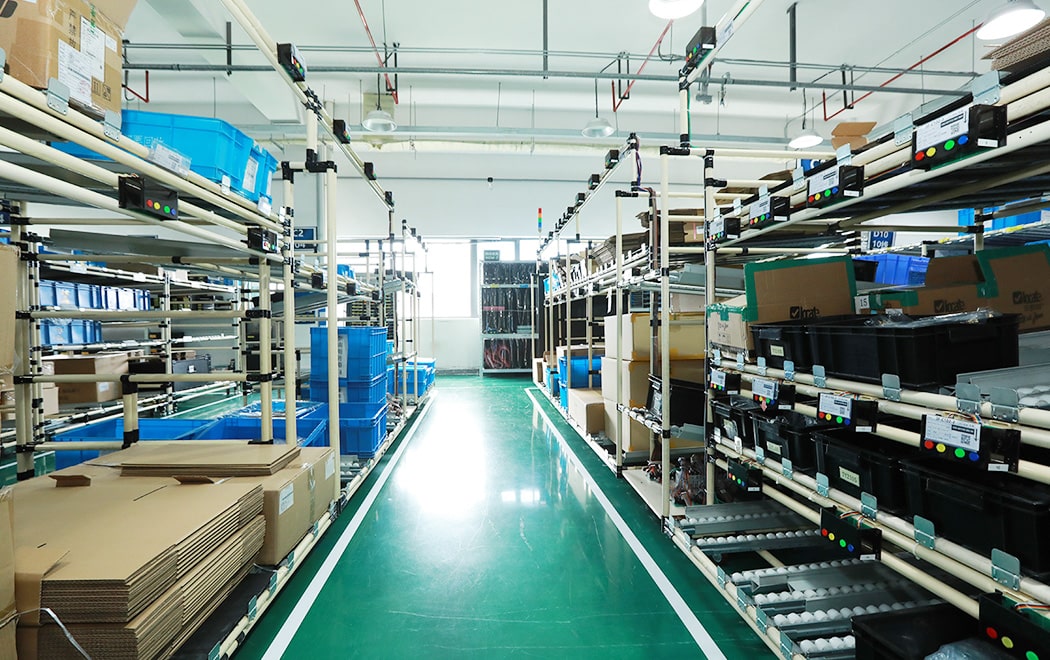 Shelves where router parts are stocked. Errors sometimes occurred when picking from 450 different parts.