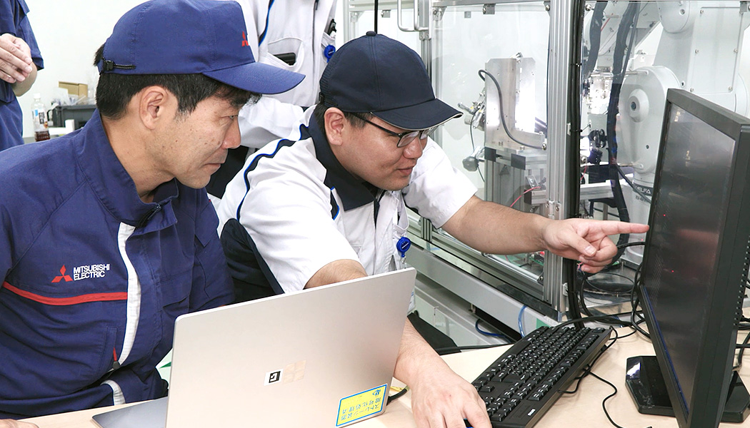Engineers from Yokowo and Mitsubishi Electric worked together to solve challenges.